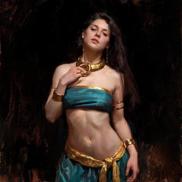 A woman in a teal and gold costume with a heavy gold collar.